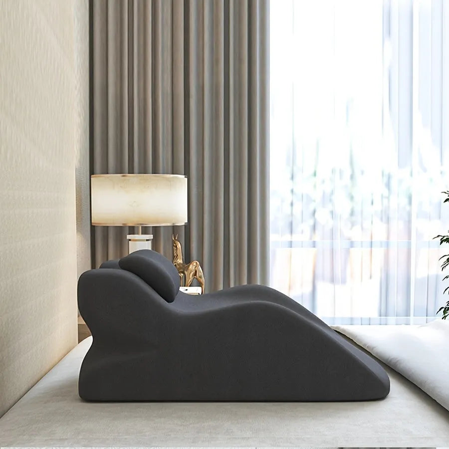 Stomach sleeper pillow in blue, designed for prone sleeping and reading.