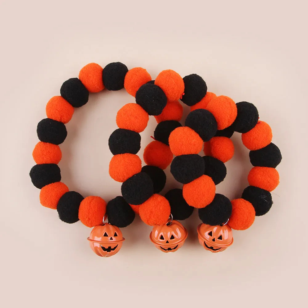 Halloween pumpkin pet collar with adjustable band, satin ribbon bow, and bell for cats and small dogs