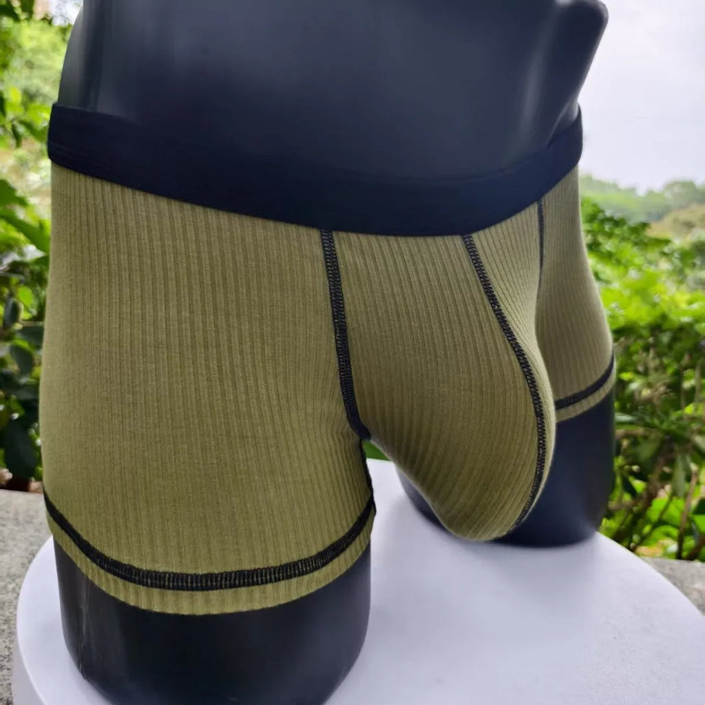 Men's solid colour breathable boxer shorts in Army Green, shown laid flat to display thin fabric and cut.