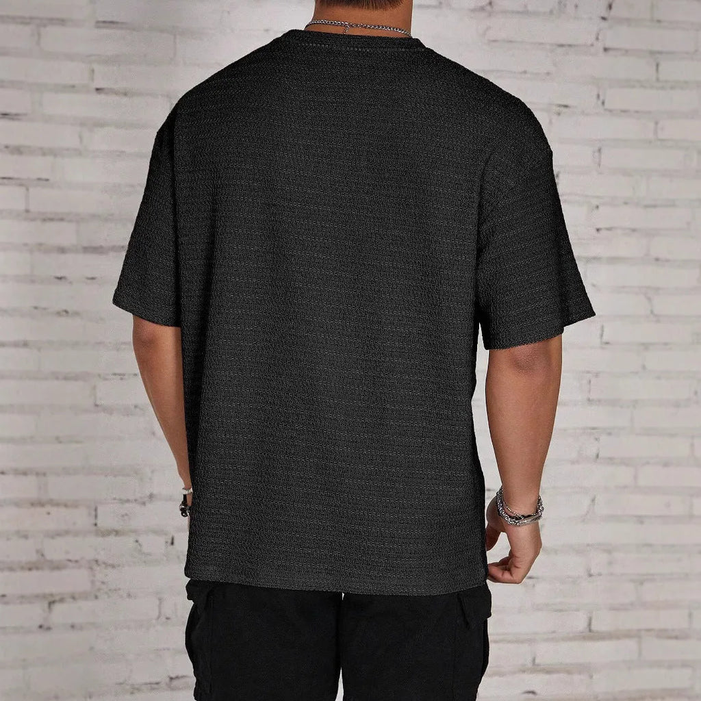 Men's loose hollow slim fit short sleeve T-shirt in lightweight polyester fabric.