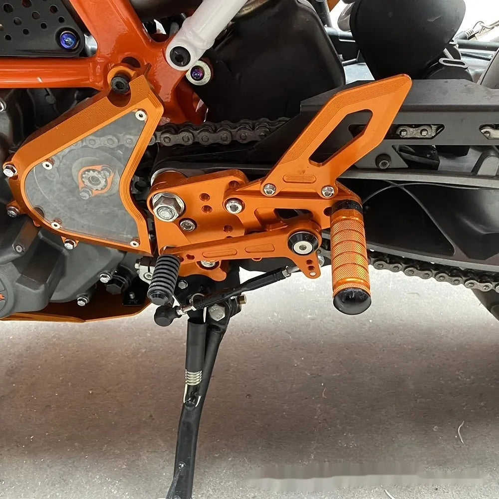 KTM DUKE rear shift pedal support assembly kit in black and orange colours