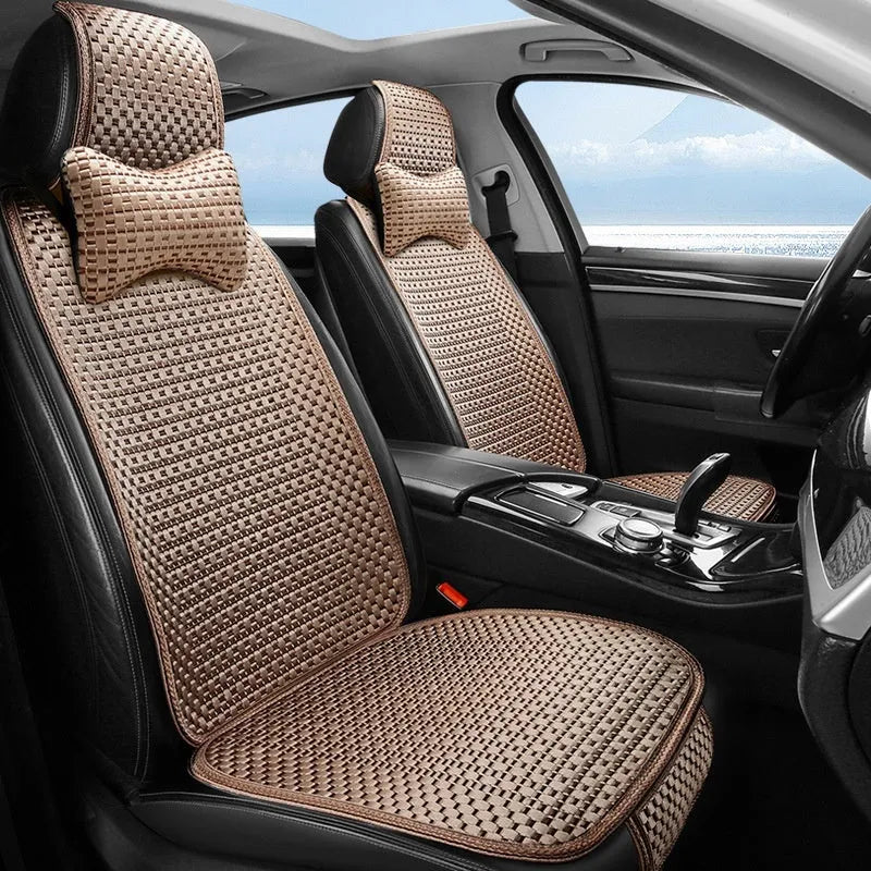 Ice silk car seat cushion in warm cream colour with flat minimalist design sitting on a car seat.