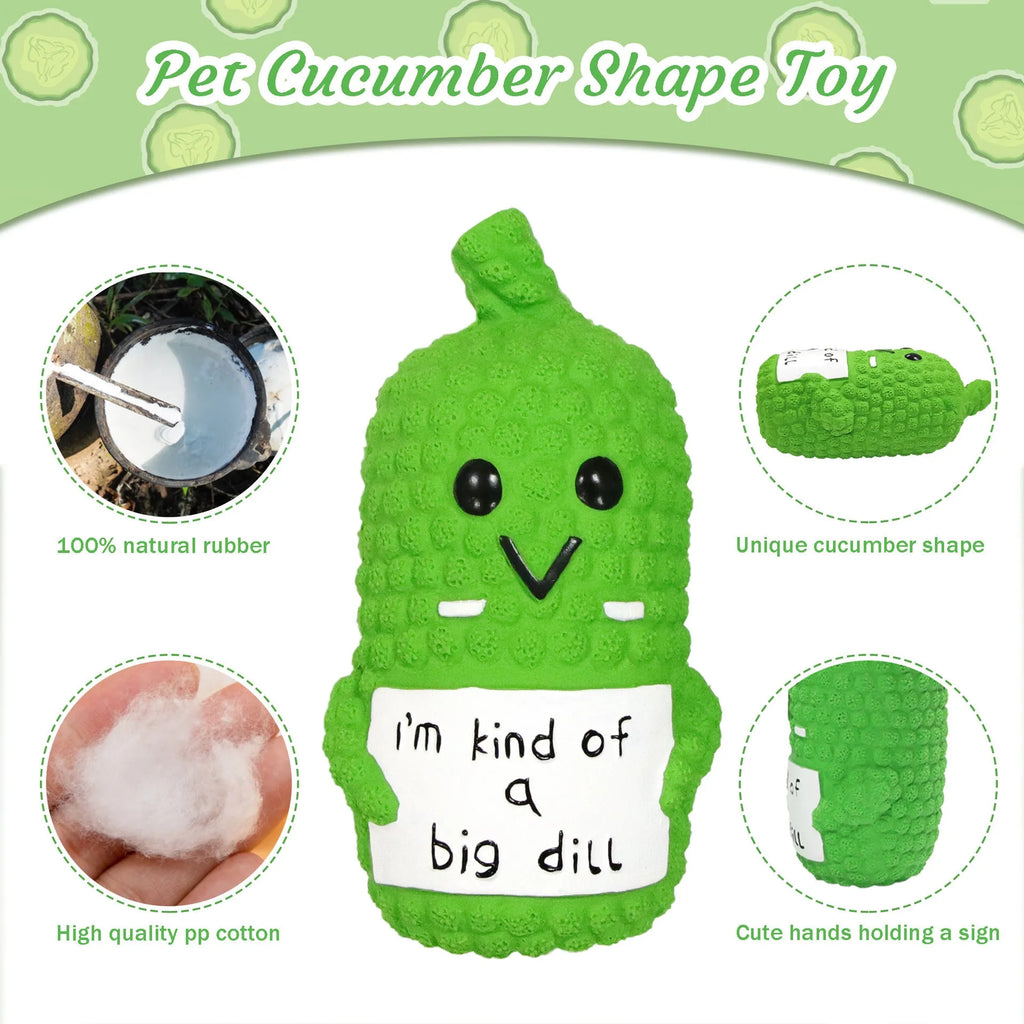Green pickle-shaped squeaky dog toy with textured nubs, shown next to a measuring tape indicating 13.6 cm length.