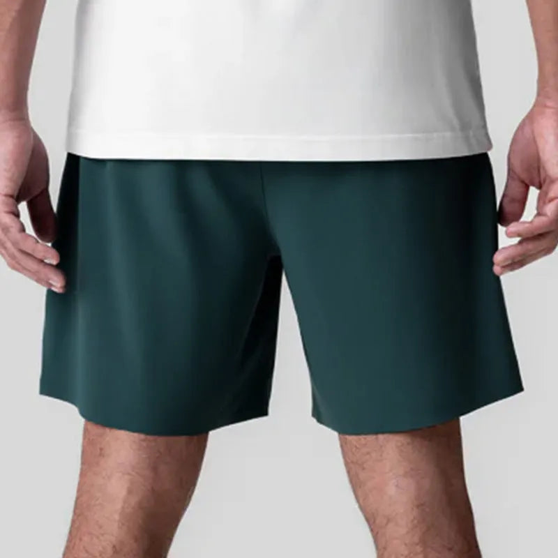 Men's grey seamless sports shorts with knee-length straight-leg design for athletic wear