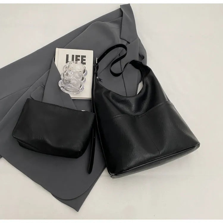 Women's large-capacity shoulder bag in soft PVC with bucket shape and stitching detail, available in black, coffee, brown, mud, beige