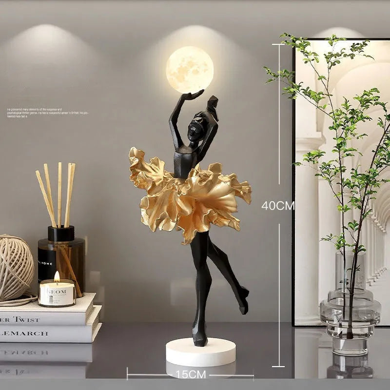 Small modern resin night lamp in black gold colour with USB charging cable.