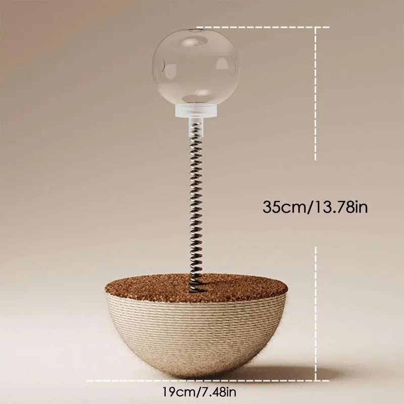 Auto-balancing cat interactive food puzzle toy in tumbler style on a floor