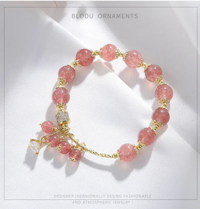 Pink crystal women's bracelet with heart-shaped charms and pearl decorative accents
