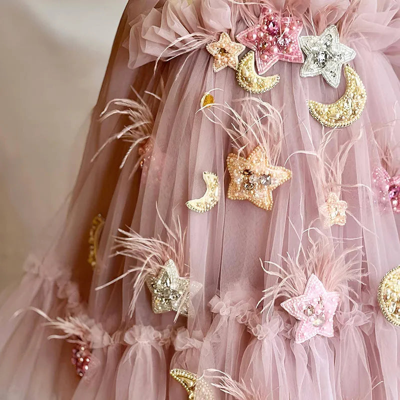 Pink children's spaghetti-strap princess dress with flower print and bow detail, cotton lining, available in 100cm to 140cm height sizes