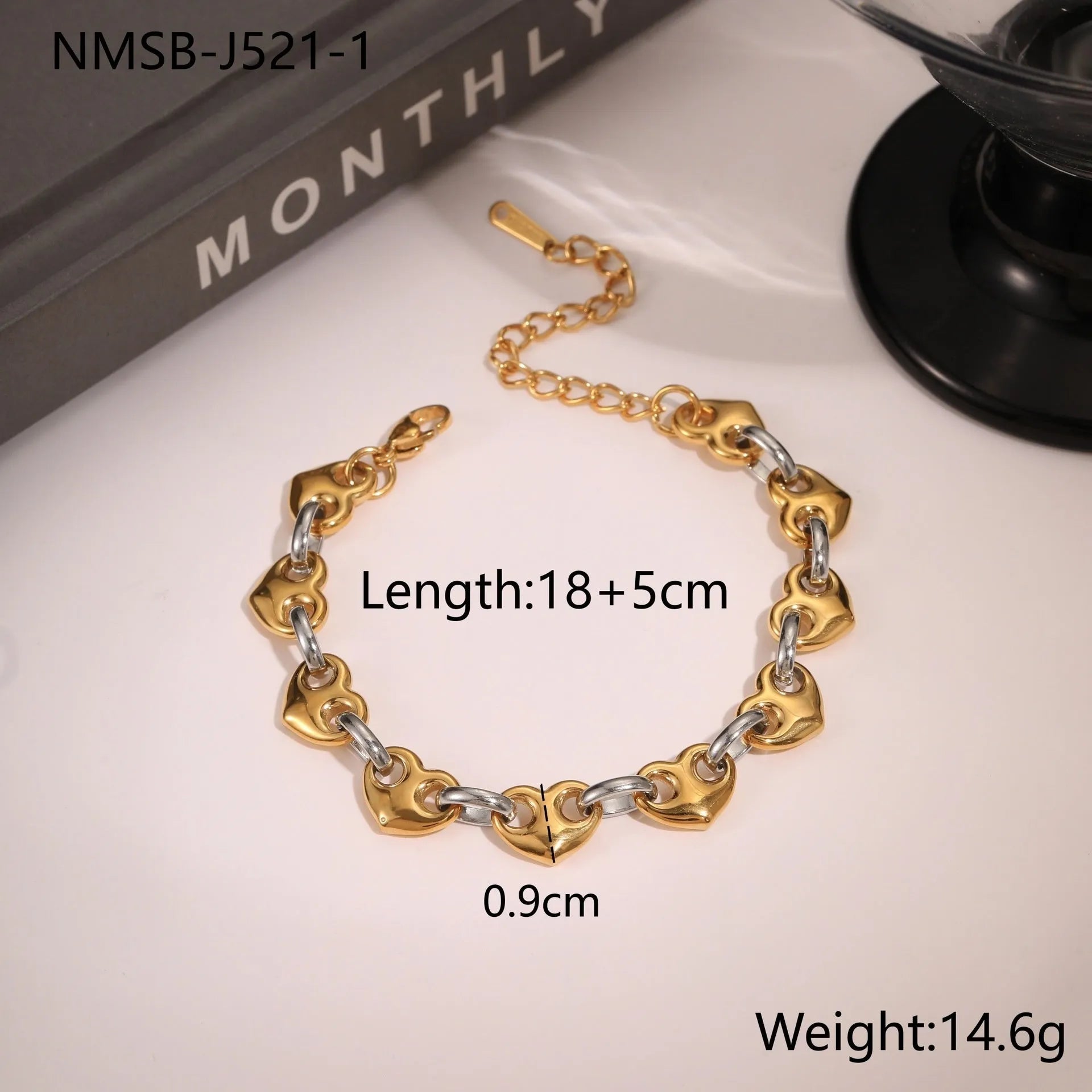 Women's stainless steel bracelet with a hollow geometric heart charm in gold or steel colour.