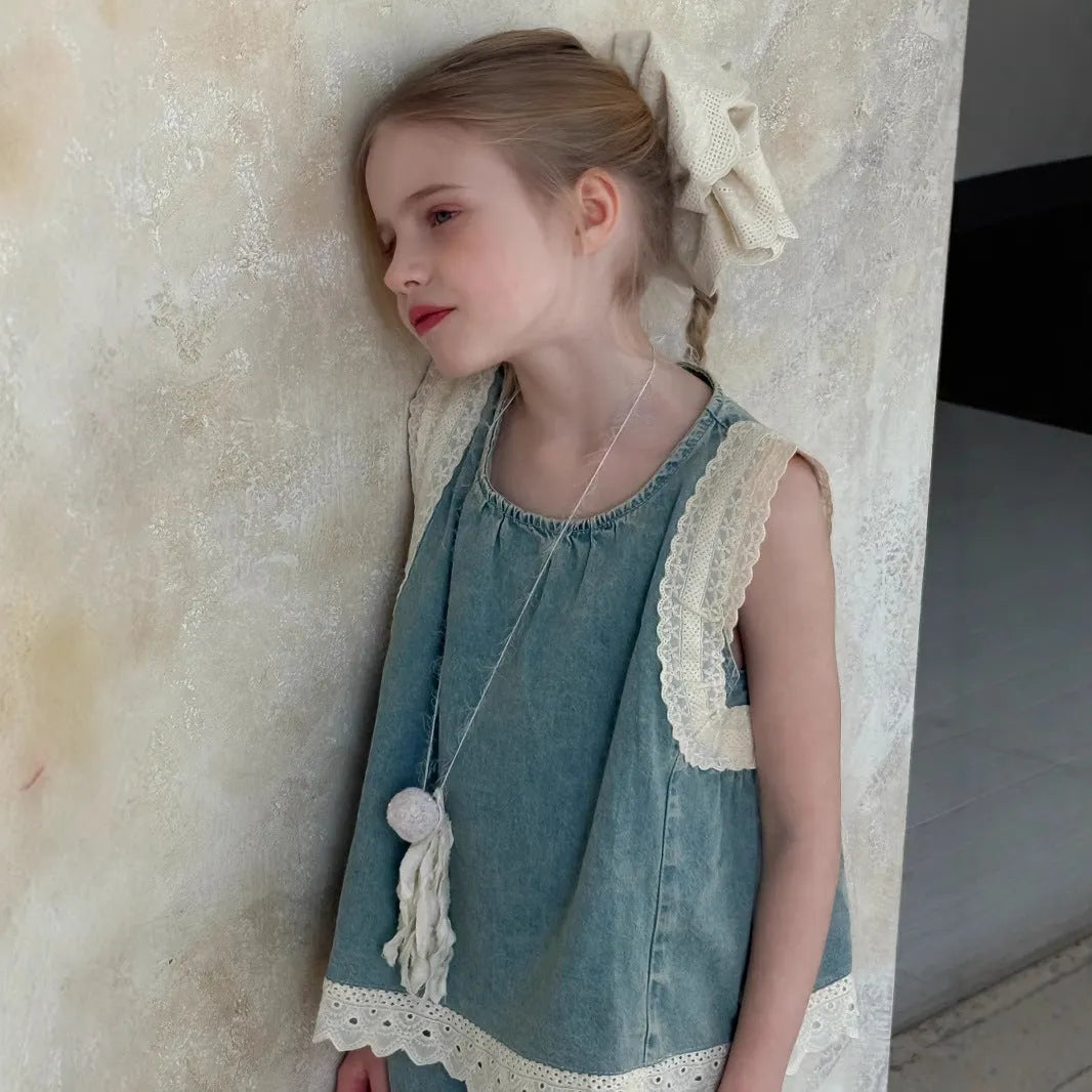 Girls' light blue cotton denim two-piece set with lace trim sleeveless vest and cropped wide-leg pants on child model