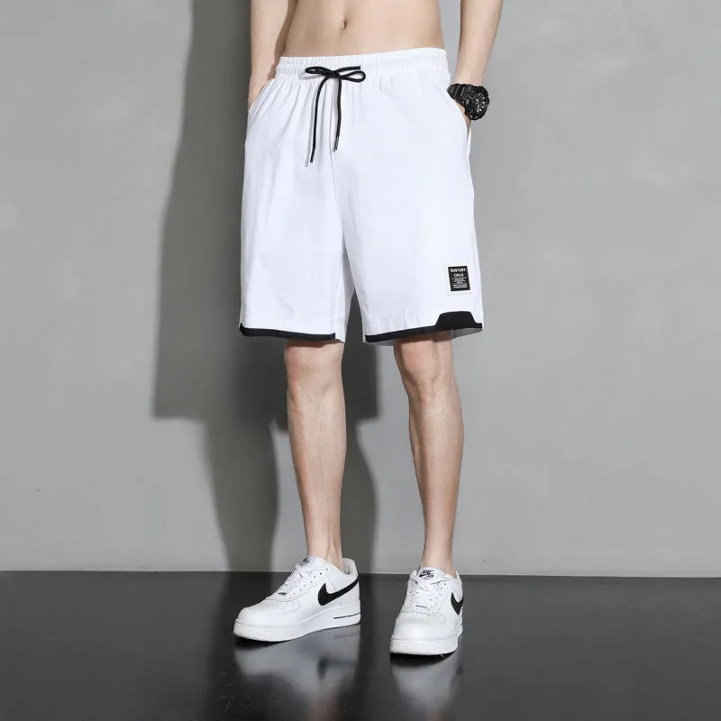 Boy wearing khaki cotton shorts with mid-waist, showing front view.