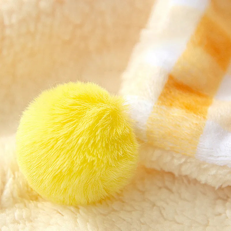 Thickened coral fleece dog blanket in blue, size 70x50cm, on a wooden floor