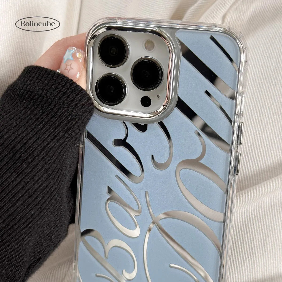 Transparent blue mirror iPhone case with JMKJ English letters showing frosted finish