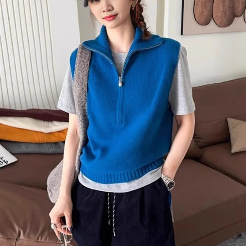 Retro half zip sleeveless knit vest in orange with 3D pattern detail