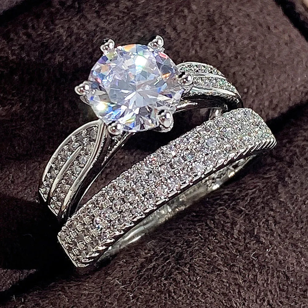 White gold colour geometric round wedding ring bracelet on display.