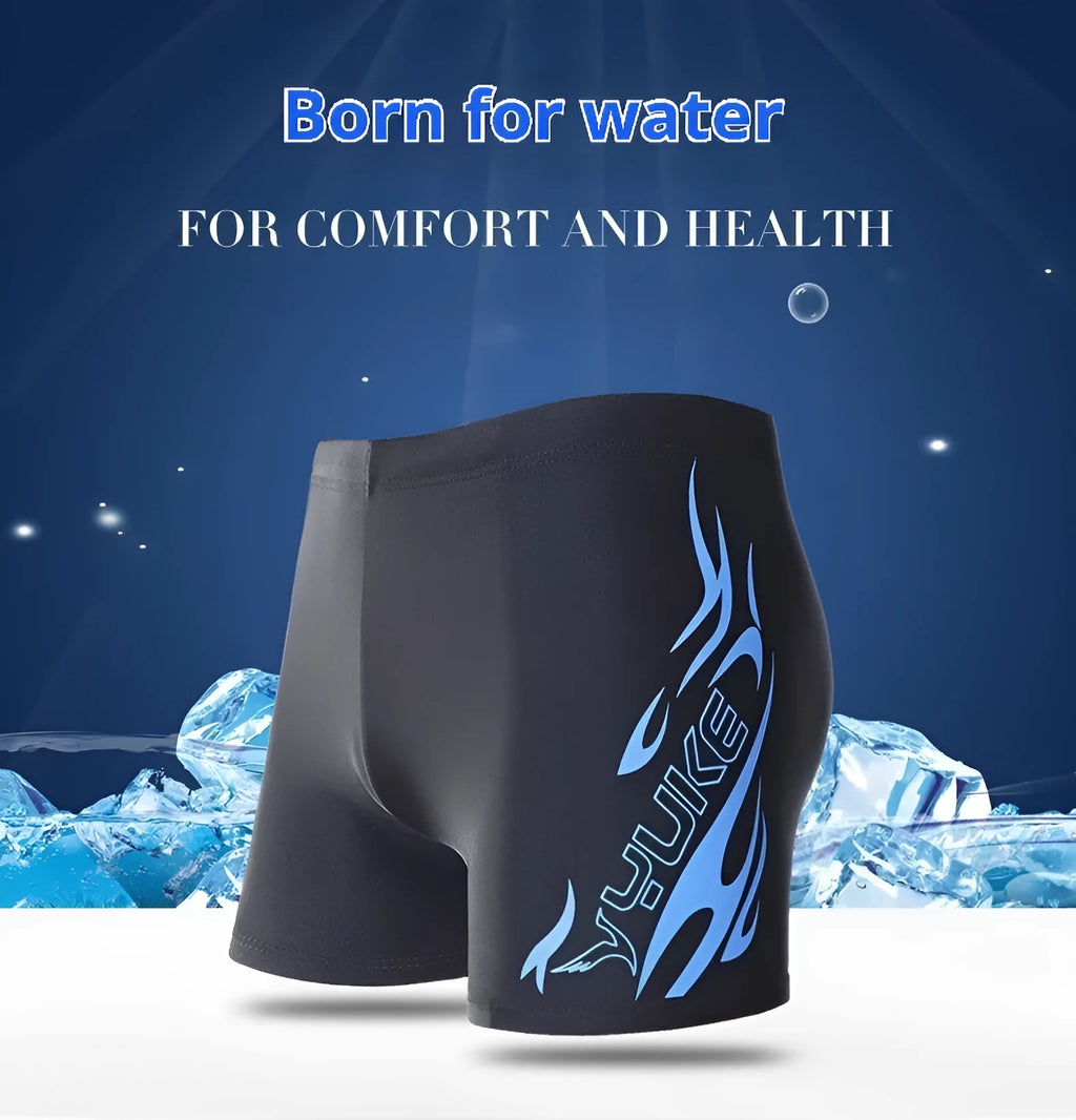 Men's plus-size blue fire pattern boxer swim trunks laid flat, with matching swimming cap.