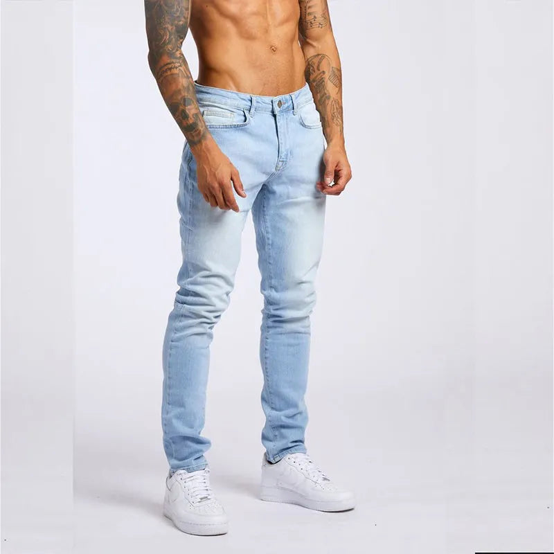 Men's fashion casual slim fit high waist jeans in light blue cotton with solid colour finish