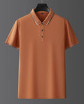 Man wearing a pure colour mulberry silk short sleeve shirt in a light summer setting.