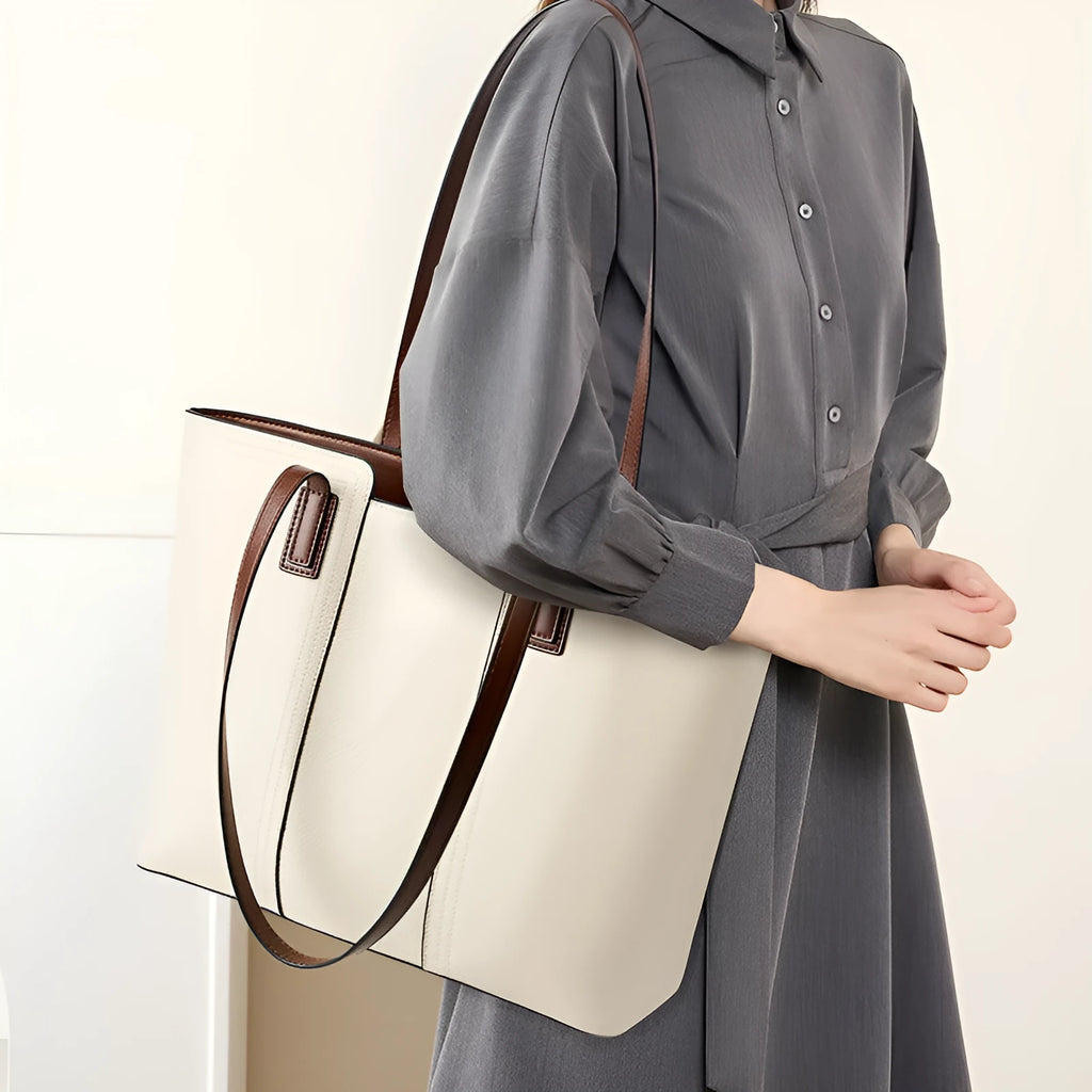 Women's black cowhide leather crossbody bag showing multiple internal compartments including phone pocket and file storage