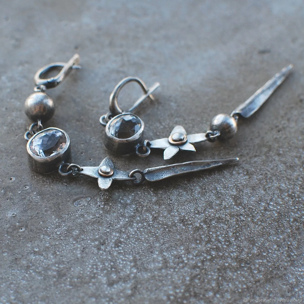 Geometric pendant drop earrings with antique silver finish and rhinestone detailing