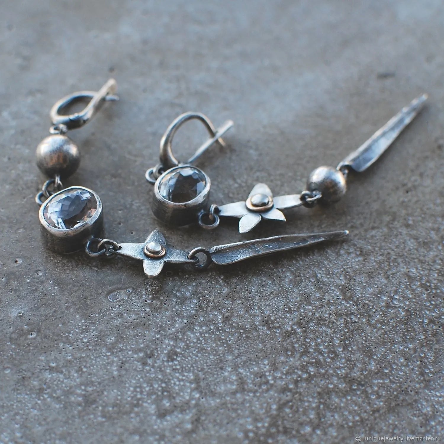 Geometric pendant drop earrings with antique silver finish and rhinestone detailing
