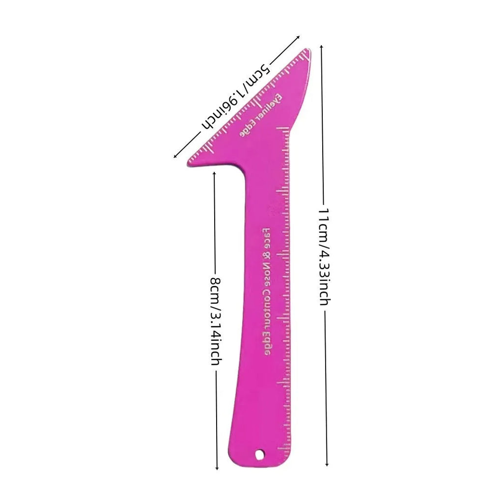 Close-up of pink reusable plastic makeup stencils for eyeliner wings, eyebrow shaping, and nose contour on a table.