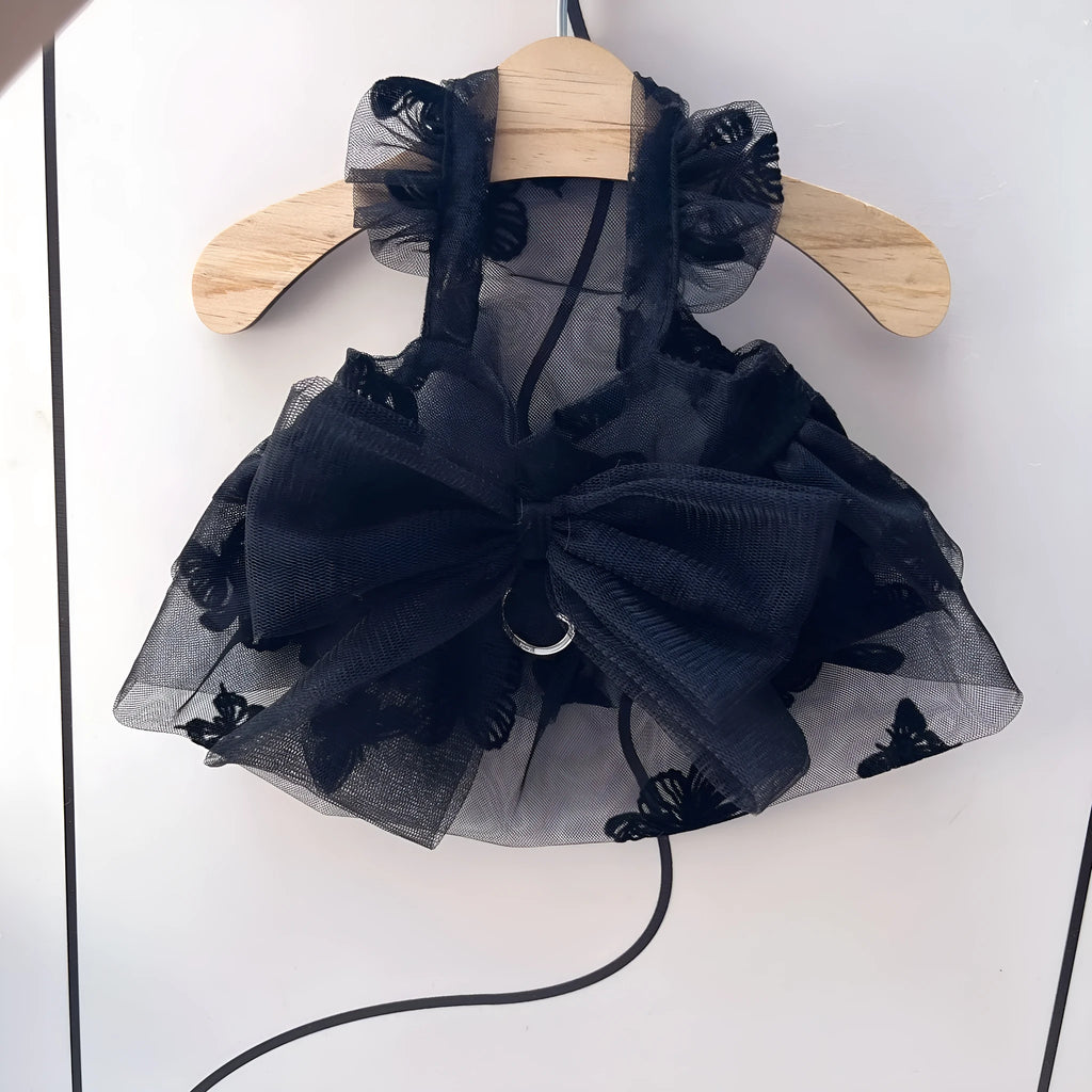Black tiered tulle princess skirt on a small dog, showing the gauze layers and fit.