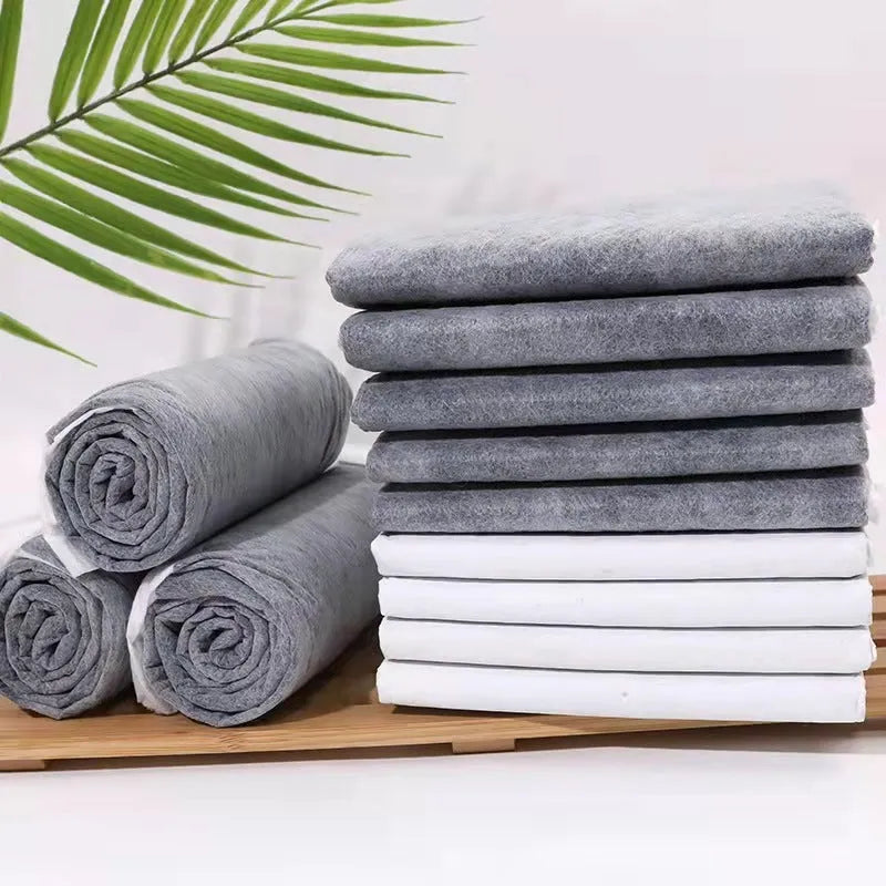 Pack of pet urinal pads showing bamboo charcoal variant in multiple sizes for dogs and cats