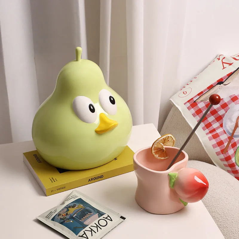 White porcelain ceramic pear-shaped tissue box with animal design in green colour