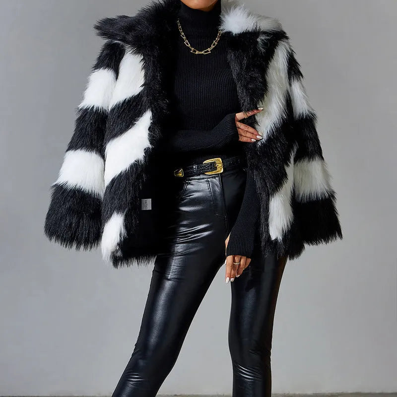 Black and white contrast lapel faux fur coat with a fur collar, shown on a model.