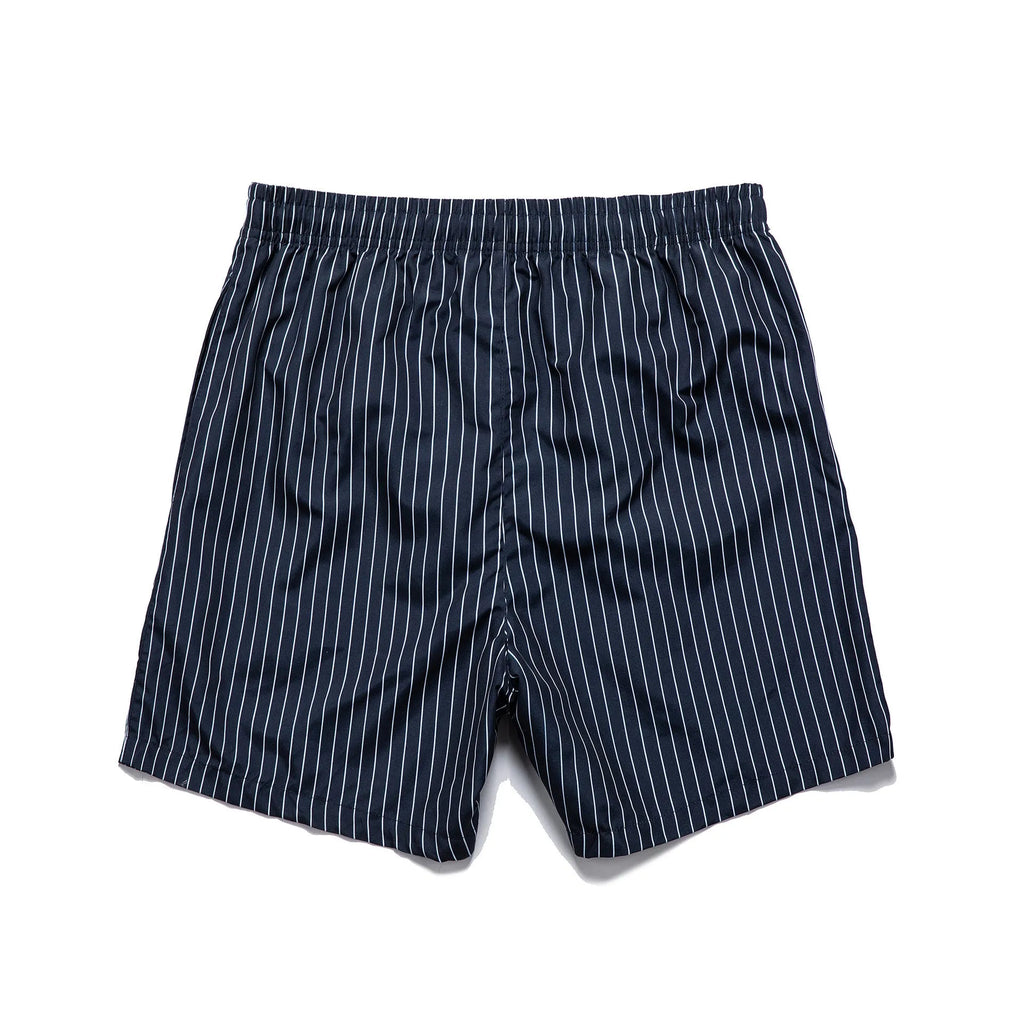 Men's navy blue polyester beach shorts with striped triangle lining and straight leg opening.