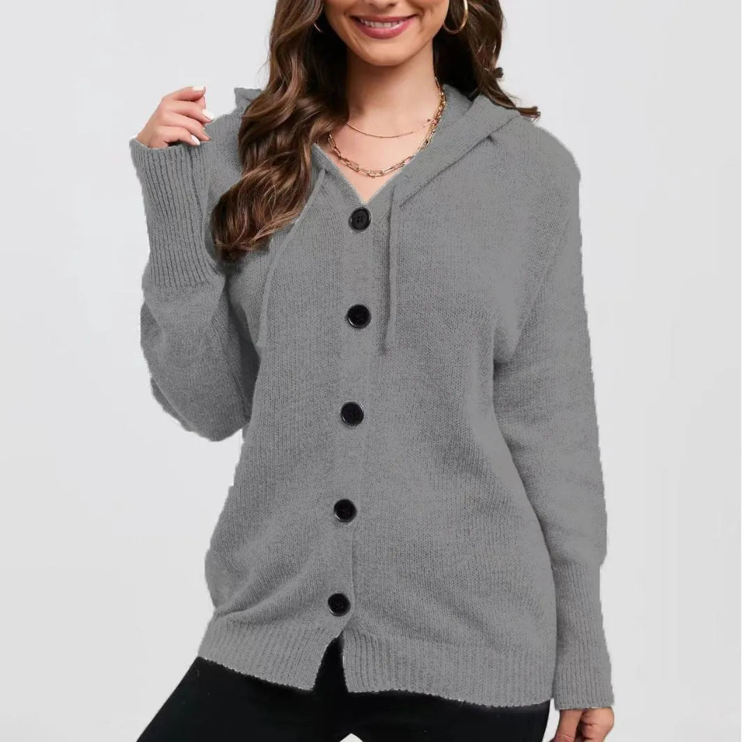 Women's loose fit thick cotton hooded cardigan sweater in a solid colour on a hanger.