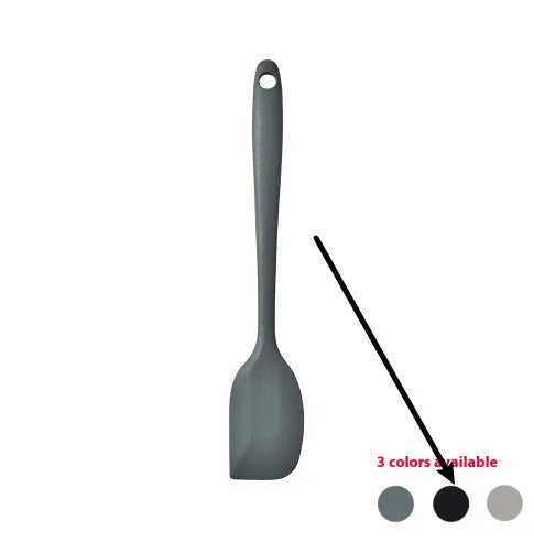 Silicone kitchen utensil set with twelve tools in a rotating white storage caddy on a counter.