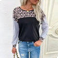 Women's black leopard print patchwork loose fit pullover sweater with round neck and long sleeves