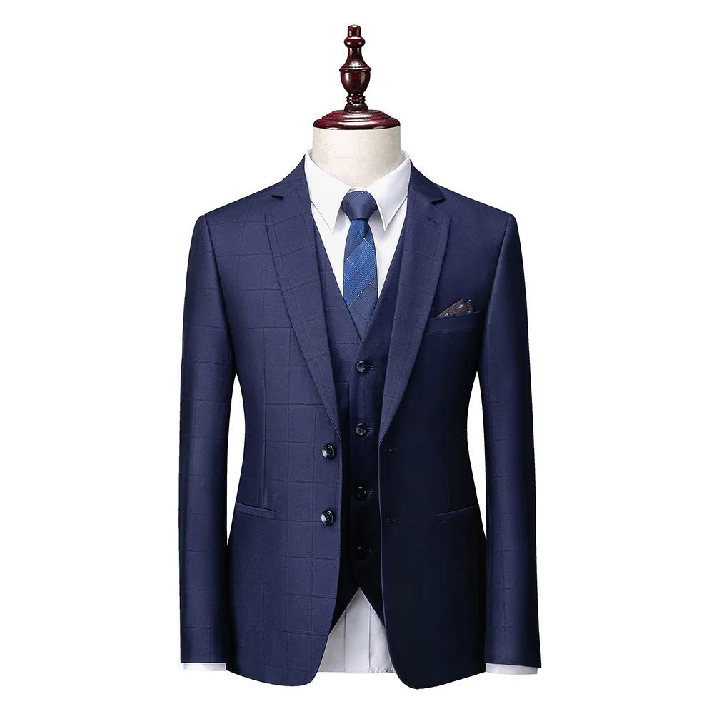 Men's navy blue plaid slim fit three-piece suit with jacket, vest, and trousers on a hanger
