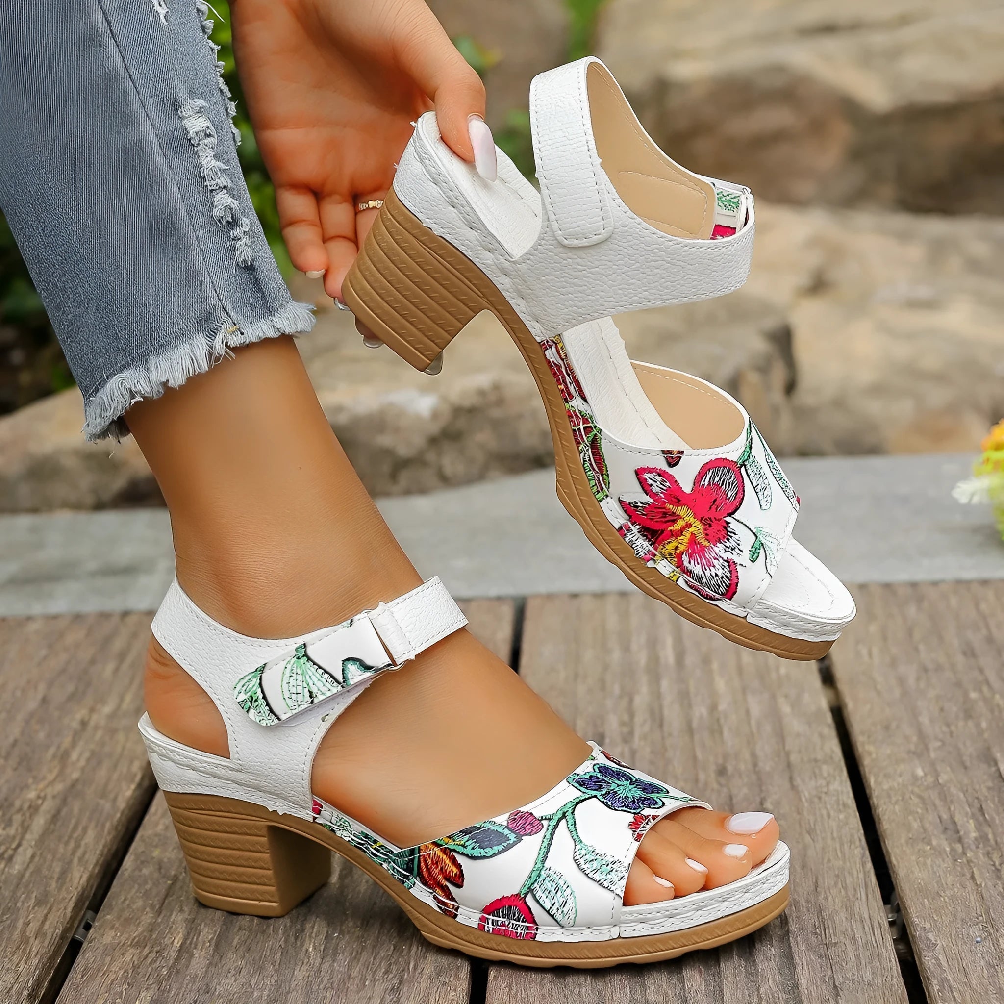 White women's high heel sandals with an adjustable Velcro strap buckle.