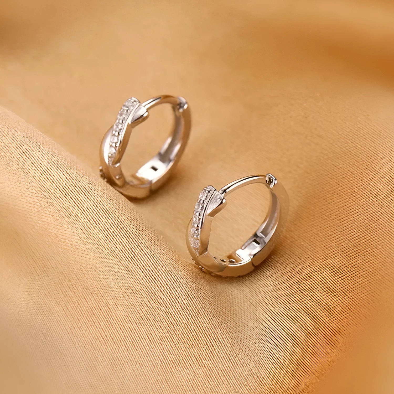 Geometric copper interwoven earrings with hemp rope design in gold or silver finish.