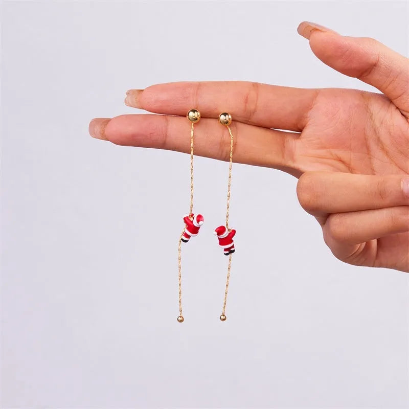 Asymmetric crawling Santa Christmas earrings for women in zinc alloy with inlaid diamond detail