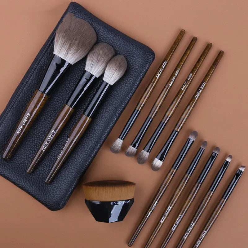 12-piece makeup brush set with wooden handles displayed in open PU brush roll