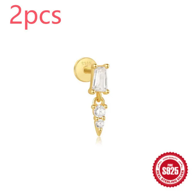 Sterling silver ear stud with a hanging gold-tone tassel charm on a white background.