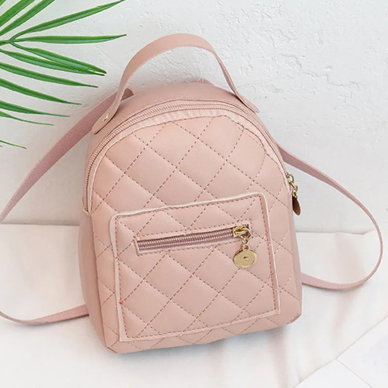Girls' hard structured backpack with embroidery in white, black, or pink colours, showing front view and soft handle.