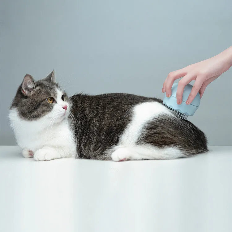 Floating massage pet needle comb with soft silicone brush head for cat hair cleaning, 75x75x73 mm, in orange pink colour