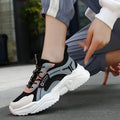 White women's casual sports shoes with mesh upper, buckle closure, and thick PU sole