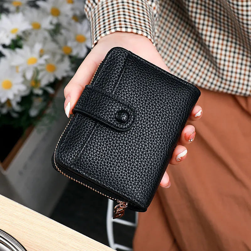Women's lychee pattern short wallet in PU leather with antibacterial lining shown in beige, pink, black, and red colour options