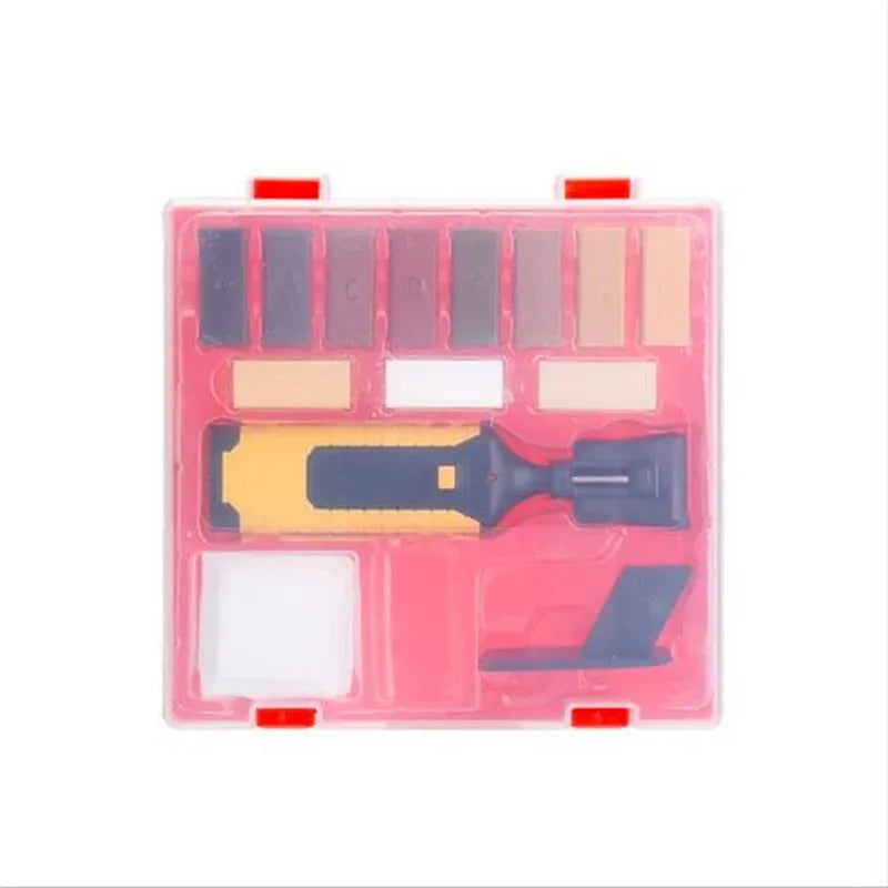 DIY floor and furniture repair kit with red handle and coloured wax sticks on a tile surface.