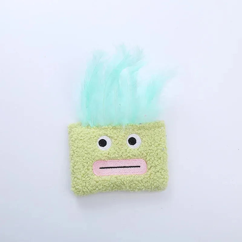 Colourful big mouth explosion head-shaped plush cat toy shown in blue, green, orange, and purple.