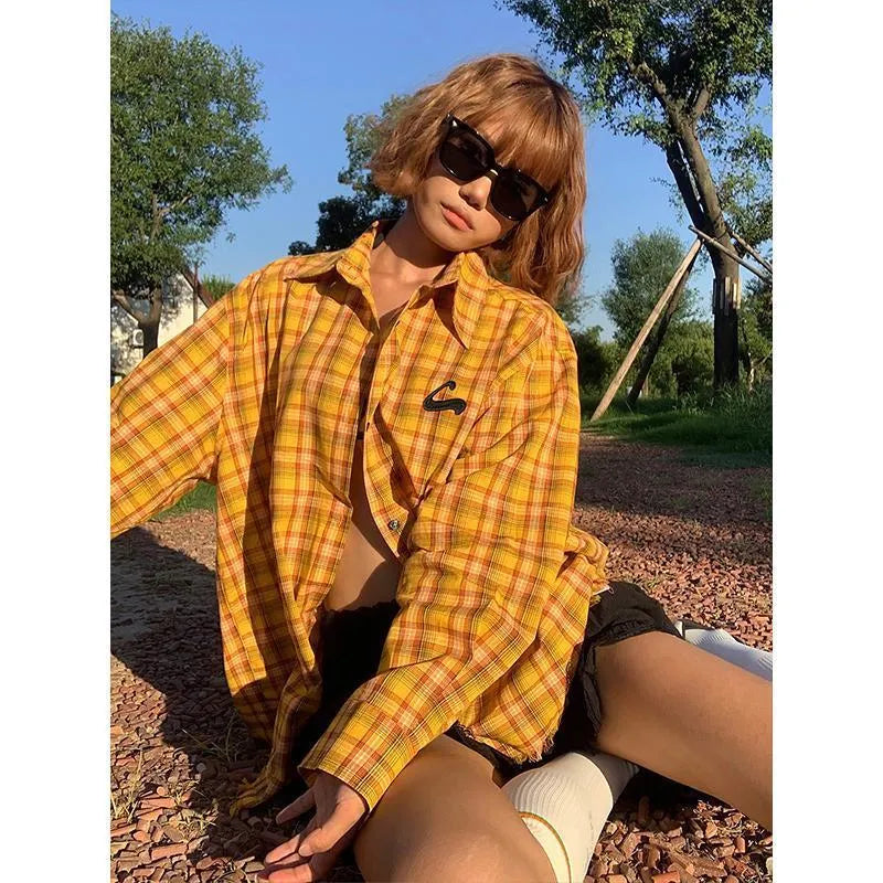Dopamine Yellow loose fit plaid shirt for men and women on a hanger.