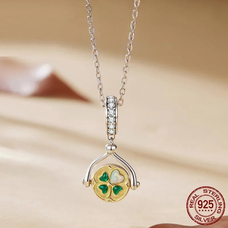 925 silver rotating card pendant with four-leaf clover pattern and wings motif on white background