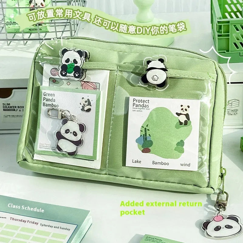 Green canvas panda pencil case showing twelve layered compartments open to reveal storage space